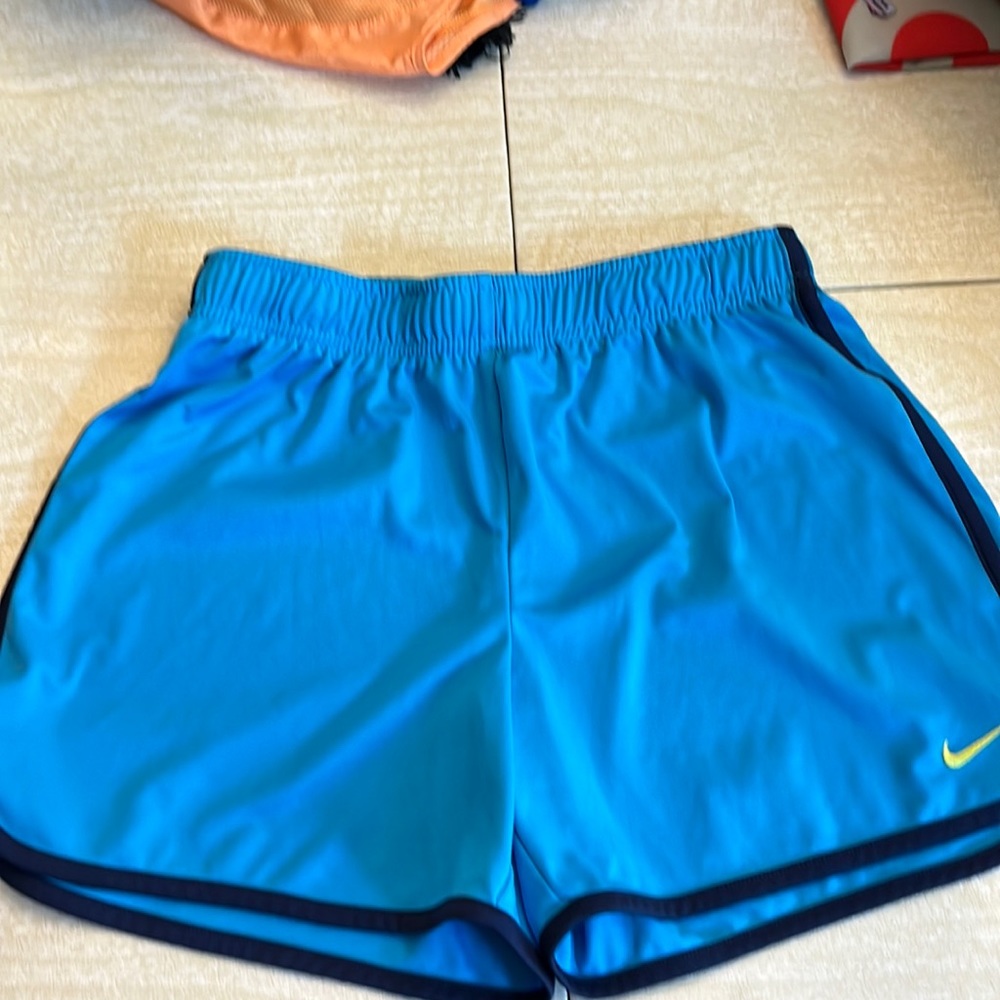 Blue Nike athletic shorts
